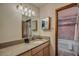 Bathroom with granite vanity and tiled shower/tub at 465 Four Oclock Rd # 323, Breckenridge, CO 80424