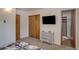 Bedroom with a TV, dresser, and closet at 465 Four Oclock Rd # 323, Breckenridge, CO 80424