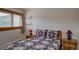 Bedroom with a rustic wooden bed frame and nightstands at 465 Four Oclock Rd # 323, Breckenridge, CO 80424