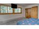 Bedroom with a built-in bench and wood closet doors at 465 Four Oclock Rd # 323, Breckenridge, CO 80424