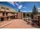 Brick courtyard with seating area and picnic table at 465 Four Oclock Rd # 323, Breckenridge, CO 80424