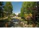 Peaceful creekside community with walking path and lush landscaping at 465 Four Oclock Rd # 323, Breckenridge, CO 80424
