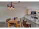 Dining area with a wooden table and chairs at 465 Four Oclock Rd # 323, Breckenridge, CO 80424