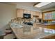 Kitchen boasts granite counters, breakfast bar, and ample cabinetry at 465 Four Oclock Rd # 323, Breckenridge, CO 80424