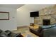 Spacious living room with a stone fireplace and a flat screen TV at 465 Four Oclock Rd # 323, Breckenridge, CO 80424