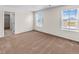 Bright bedroom with neutral carpeting and large windows at 7302 Arkansas Street, Frederick, CO 80530