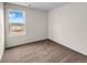 Bright bedroom with neutral walls, brown carpet, and a window offering a view at 7302 Arkansas Street, Frederick, CO 80530
