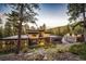 Modern home nestled in the mountains with a large deck and two-car garage at 32651 Buffalo Creek Rd, Evergreen, CO 80439