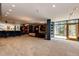 Spacious basement recreation room with wet bar, fireplace, and large windows at 32651 Buffalo Creek Rd, Evergreen, CO 80439