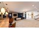 Finished basement with bar, game area, and plenty of space for entertaining at 32651 Buffalo Creek Rd, Evergreen, CO 80439