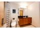 Clean bathroom with modern vanity, toilet and shower/tub combo at 32651 Buffalo Creek Rd, Evergreen, CO 80439