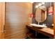 Modern bathroom with unique wood wall and a vessel sink at 32651 Buffalo Creek Rd, Evergreen, CO 80439