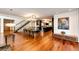 Modern dining room with hardwood floors and a view into the kitchen at 32651 Buffalo Creek Rd, Evergreen, CO 80439