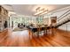 Open dining area with hardwood floors and a stone fireplace at 32651 Buffalo Creek Rd, Evergreen, CO 80439