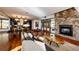 Open concept dining room with hardwood floors, modern lighting, and access to patio at 32651 Buffalo Creek Rd, Evergreen, CO 80439