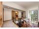 Upper level hallway with wood railing and large windows offering natural light and views at 32651 Buffalo Creek Rd, Evergreen, CO 80439