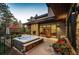 Hot tub on a patio with mountain views and a fireplace at 32651 Buffalo Creek Rd, Evergreen, CO 80439