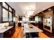 Spacious kitchen featuring dark wood cabinetry and a large island at 32651 Buffalo Creek Rd, Evergreen, CO 80439