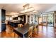 Modern kitchen with dark cabinetry, large island, and stainless steel appliances at 32651 Buffalo Creek Rd, Evergreen, CO 80439