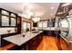 Gourmet kitchen with center island, stainless steel appliances, and hardwood floors at 32651 Buffalo Creek Rd, Evergreen, CO 80439