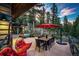 Outdoor patio with dining area, hot tub, and mountain views at 32651 Buffalo Creek Rd, Evergreen, CO 80439