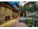 Backyard patio with hot tub and fireplace, mountain views at 32651 Buffalo Creek Rd, Evergreen, CO 80439