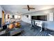 Home studio or gym with a drum set, desk, and large TV at 32651 Buffalo Creek Rd, Evergreen, CO 80439