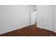 Simple bedroom with dark wood flooring and closet at 305 Ravine Way, Brighton, CO 80603