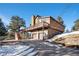 Two-story home with attached two-car garage and deck at 27203 Arrowhead Ln, Conifer, CO 80433