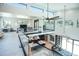 Open floor plan with two-story ceilings, kitchen island, and dining area at 4960 S Lipan Dr, Englewood, CO 80110