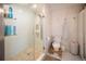 Clean bathroom with a walk-in shower and tiled floors at 4960 S Lipan Dr, Englewood, CO 80110