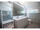Modern bathroom with double vanity and mosaic tile at 4960 S Lipan Dr, Englewood, CO 80110