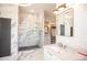 Elegant bathroom with a walk-in shower, modern vanity, and ample closet space at 4960 S Lipan Dr, Englewood, CO 80110