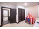 Well-lit bedroom with a play tent and spacious closet at 4960 S Lipan Dr, Englewood, CO 80110
