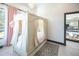 Charming bedroom with a unique canopy bed and plenty of natural light at 4960 S Lipan Dr, Englewood, CO 80110