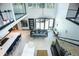 Two-story dining area with a chandelier and large windows at 4960 S Lipan Dr, Englewood, CO 80110