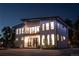 Modern two-story house exterior, illuminated at night at 4960 S Lipan Dr, Englewood, CO 80110
