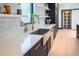 Modern kitchen with custom cabinetry and a farmhouse sink at 4960 S Lipan Dr, Englewood, CO 80110