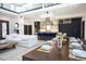 Modern kitchen with navy cabinets, a large island, and high-end appliances at 4960 S Lipan Dr, Englewood, CO 80110