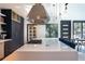 Modern kitchen with a center island and ample counter space at 4960 S Lipan Dr, Englewood, CO 80110