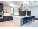 Modern kitchen with a large island and stainless steel appliances at 4960 S Lipan Dr, Englewood, CO 80110