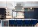 Modern kitchen with a large island and pendant lighting at 4960 S Lipan Dr, Englewood, CO 80110