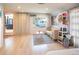 Light and airy living room with hardwood floors and outdoor view at 4960 S Lipan Dr, Englewood, CO 80110