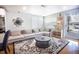Spacious living area with a sectional sofa and access to patio at 4960 S Lipan Dr, Englewood, CO 80110