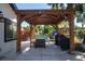 Outdoor patio with pergola, grill, and seating area at 4960 S Lipan Dr, Englewood, CO 80110