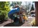 Wooden playset with a slide and climbing structure at 4960 S Lipan Dr, Englewood, CO 80110