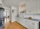 Clean kitchen with white cabinets and hardwood floors at 200 Colorado Blvd, Denver, CO 80206