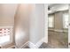Bright bedroom with grey carpet, large window, and ceiling fan at 212 S Sherman St, Denver, CO 80209