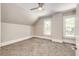 Bright bedroom with carpet, ceiling fan, and two windows at 212 S Sherman St, Denver, CO 80209
