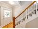 Classic staircase with wooden railing and carpeting at 212 S Sherman St, Denver, CO 80209